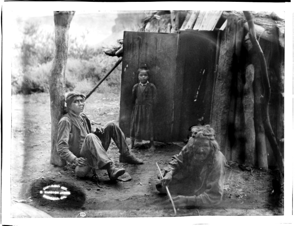 Three Havasupai Indians, Waluthama, his father and daughter, in front of their Hawa or dwelling, ca.1899 (CHS-3782)