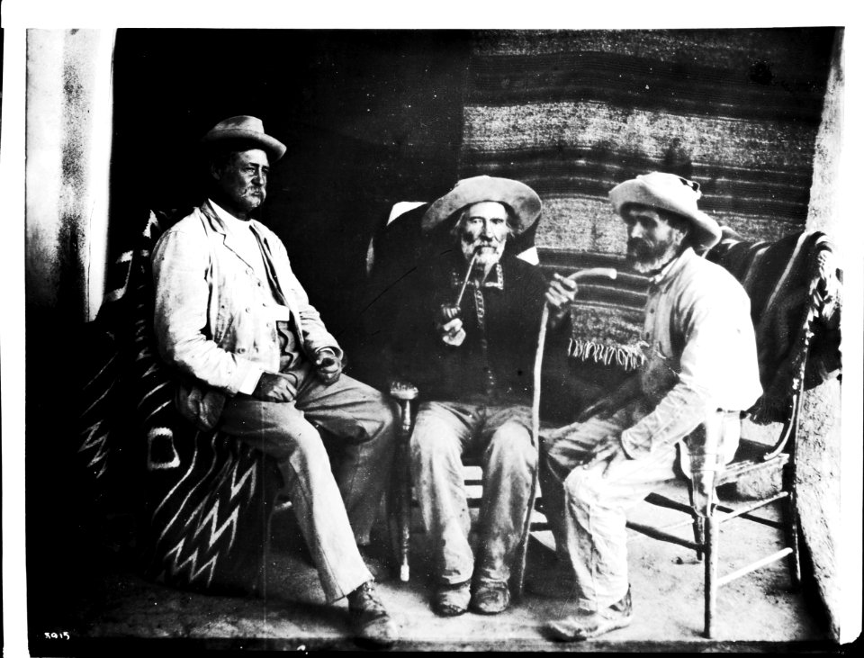 Three Indian fighters shown indoors, at the pueblo of Cibolleta, New Mexico, ca.1900 (CHS-3915)