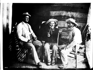 Three Indian fighters shown indoors, at the pueblo of Cibolleta, New Mexico, ca.1900 (CHS-3915) photo