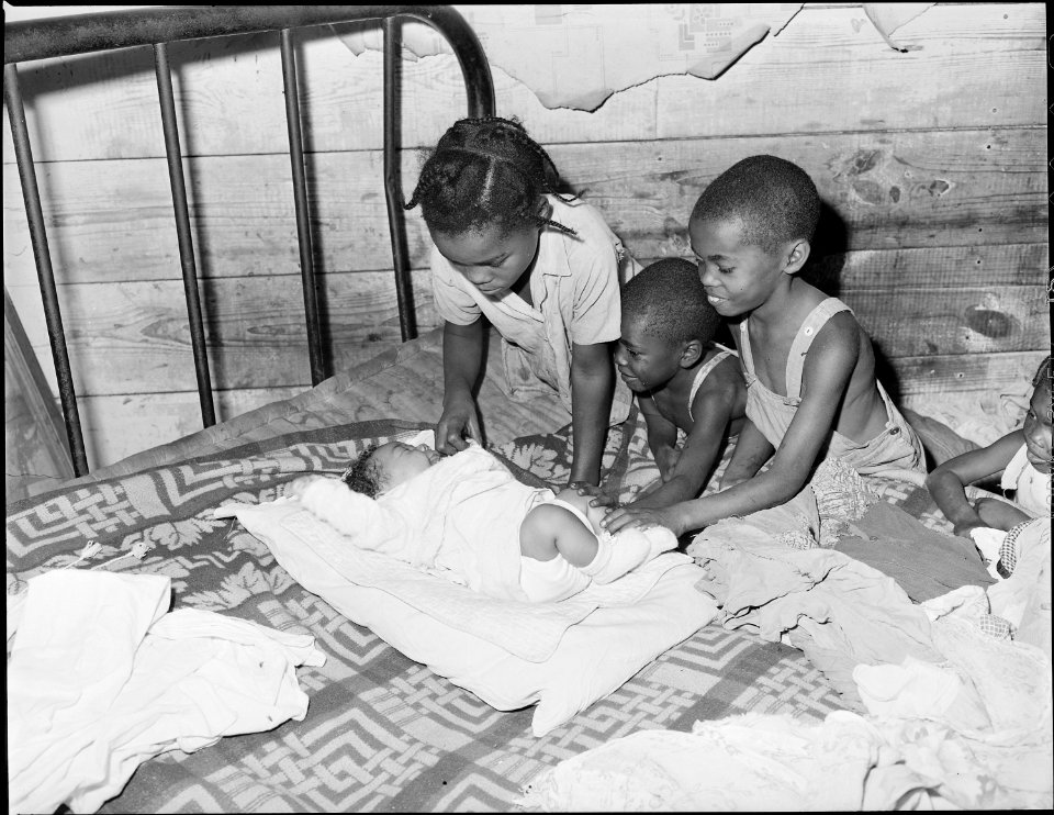 Three of Lawson Mayo's ten children admire the youngest baby. Mullens Smokeless Coal Company, Mullens Mine, Harmco... - NARA - 540971