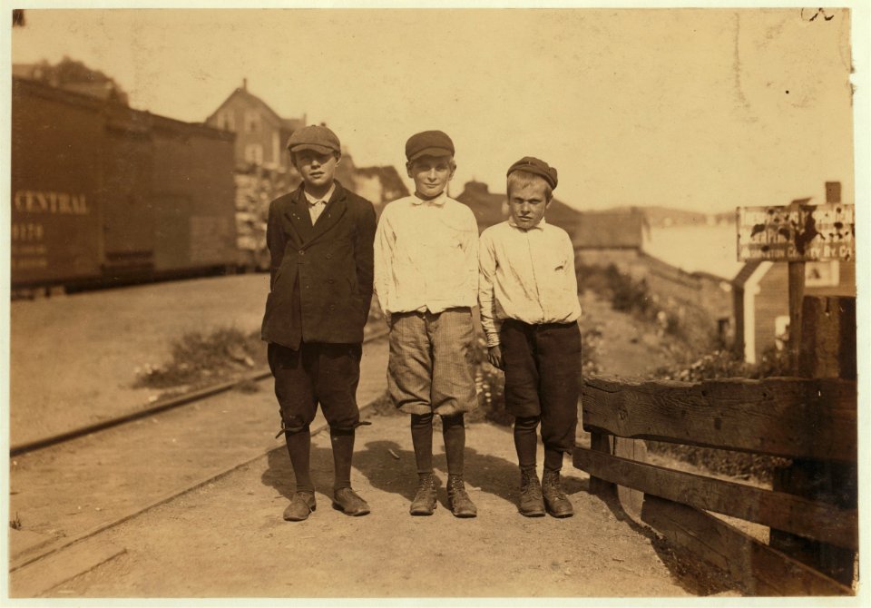 Three young cutters who work in the Seacoast Canning Co., Factory -4, Eastport, Me. They work at night when the rush is on. Youngest is Rob Collins, 10 years old; next is Dan Collins, 11 LOC nclc.00946