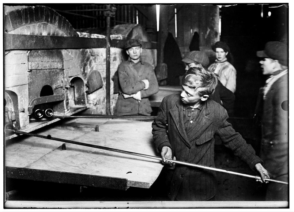 Three years in the Glass House and no chance for promotion yet. Boy in foreground been 'carry-in' since he was 14 years old. Wormser's Glass House. LOC cph.3a13363