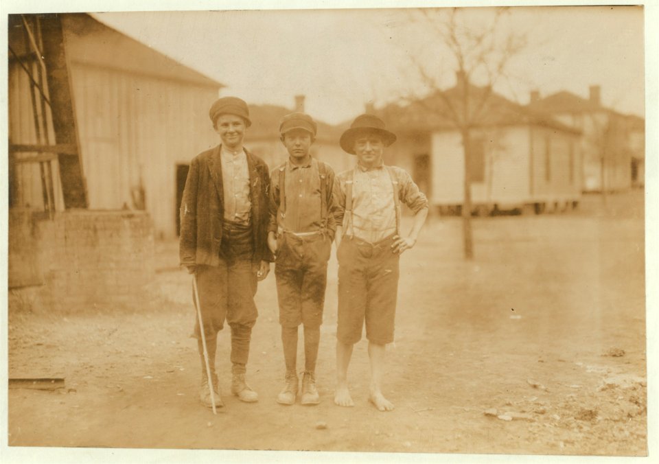 Three youngsters in Avondale Mills. Boy in middle, John Douglas said, 'I've been to school my eight weeks. Work now. Been workin' a year.' (None of them, even the tiniest, would admit being LOC nclc.01939