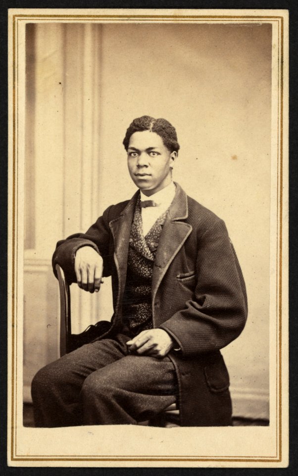 Three-quarter-length portrait of an unidentified African American man, wearing suit, seated) - J. N. Ramsdill, Photographer, Bath Street, Ballston Spa, N.Y LCCN2010647817