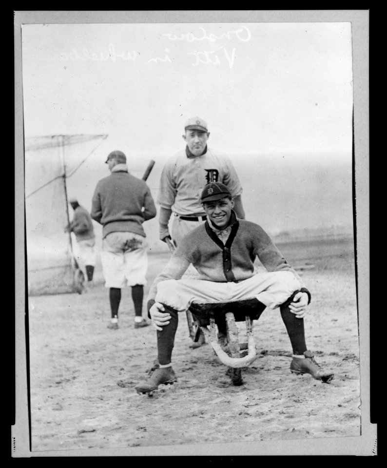 Tiger Jack Onslow pushes wheelbarrow containing Ossie Vitt, 3-20-1912 (baseball) LCCN2005684117