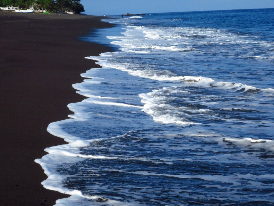 Water beach black sand photo