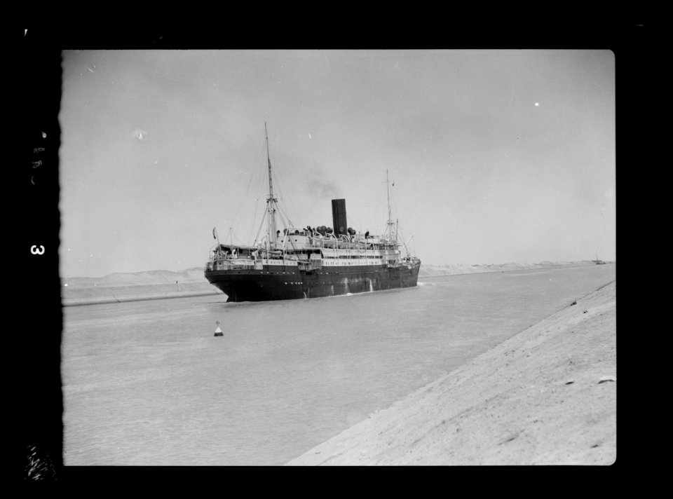 To Sinai by car. The Suez Canal. Steamship passing through LOC matpc.15555