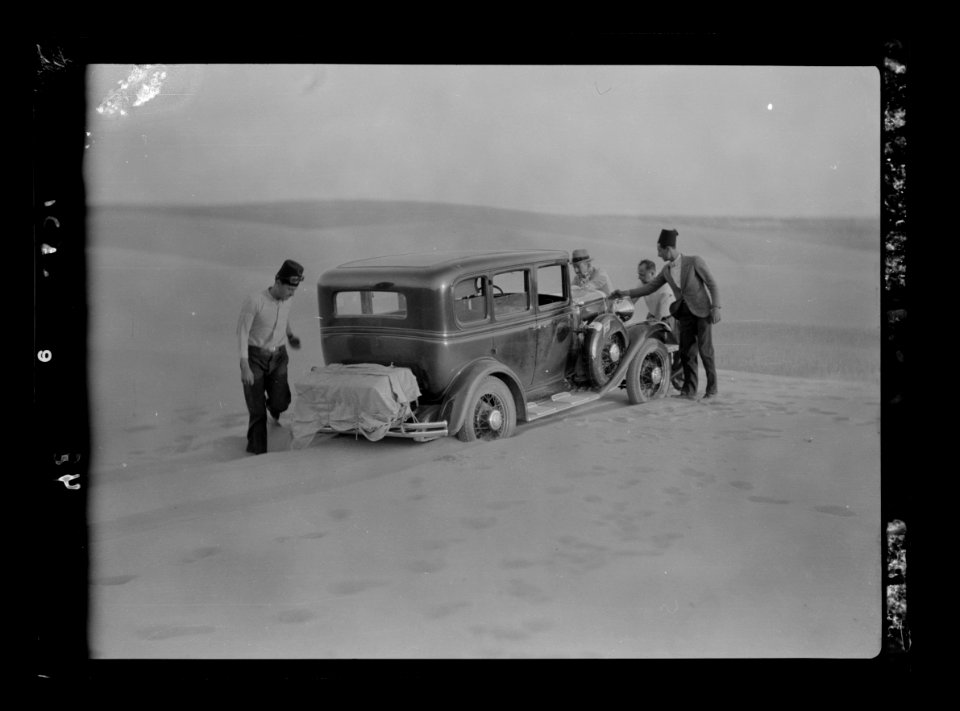 To Sinai by car. Car stuck in the midst of a sand dune. Sand drifts across the road LOC matpc.15552
