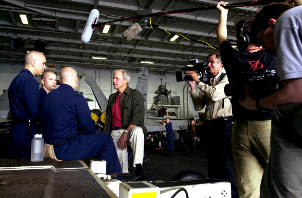 Tom Brokaw records an interview with US Navy Sailors
