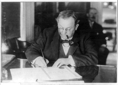 Tom Loftin Johnson, 1854-1911, half-length portrait, seated, writing at desk LCCN2005691502
