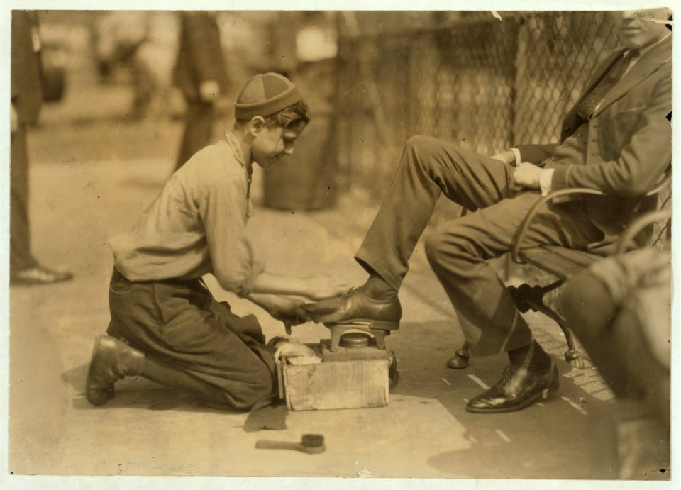 Tony, a twelve year old bootblack at his station in Bowling Green, New York City. He says he makes from $2. to $3. a day regularly. July 25, 1924. LOC nclc.04037