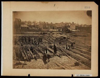 Track near the Potomac River, in Alexandria. Lumber; part of construction force at work, &c LCCN2005696801