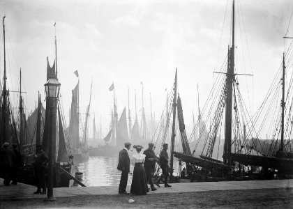 Trawlers berthed in the outer harbour with the morning mist rising. RMG P27518