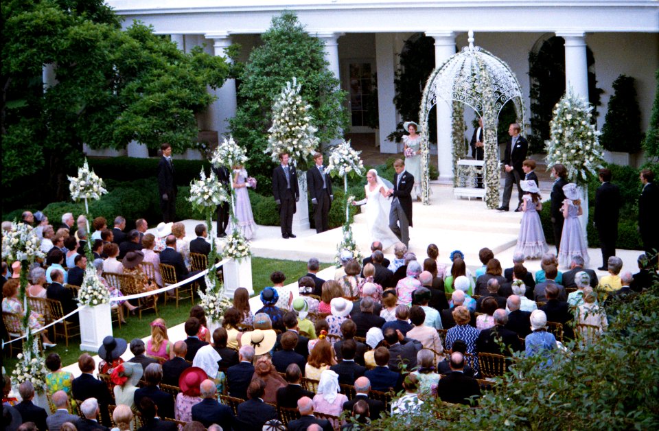 Tricia Nixon Cox and husband Ed Cox walk down the aisle at their White House Wedding in the Rose Garden