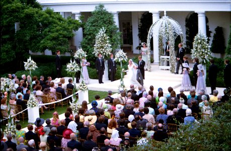 Tricia Nixon Cox and husband Ed Cox walk down the aisle at their White House Wedding in the Rose Garden photo