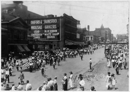 Troops departing for training camps. Minute Men escorting recruits (African American) recruits. - NARA - 533582
