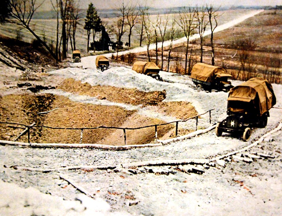 Trucks driving around a bomb crater during WWI, June 6, 1918 (30954226932)