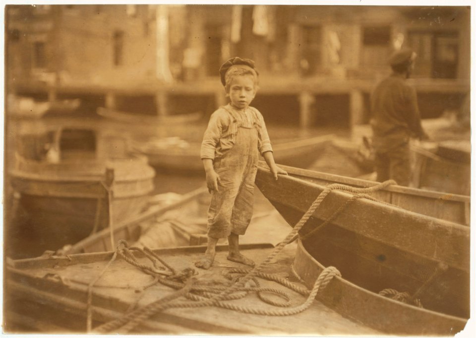 Truant hanging around boats in the harbor during school hours. LOC nclc.05427