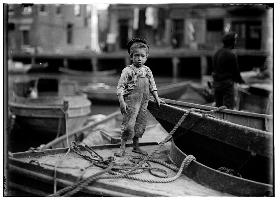 Truant hanging around boats in the harbor during school hours. LOC nclc.05427
