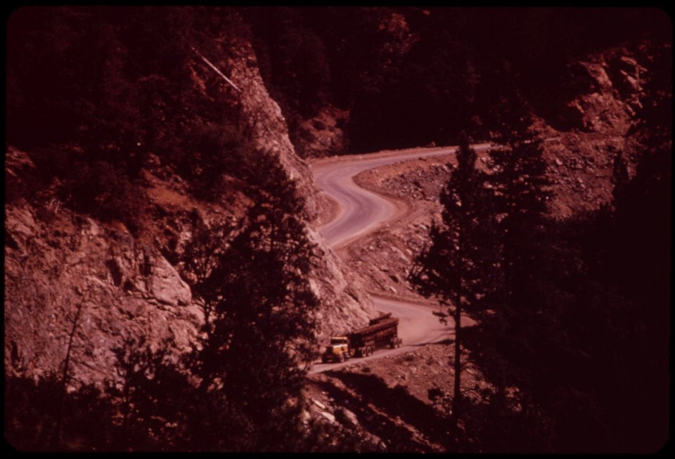 Truck-with-salvaged-timber-leaves-burn-site-for-trip-to-standard-crews-are-in-race-against-fall-snows-which-bring-a-virtual-halt-to-logging-in-the-area-september-1973 7007034690 o