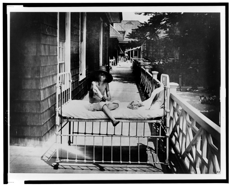 Tubercular child seated on bed, outdoors, at Sea Breeze Hospital, Coney Island, New York LCCN99472323