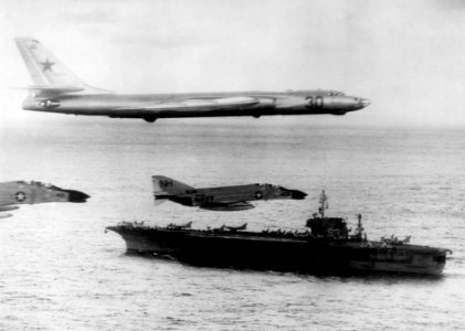 Tu-16 flying over USS Kitty Hawk (CVA-63) 1963