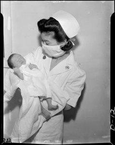 Tule Lake Relocation Center, Newell, California. Kiyo Kobayashi, Registered Nurse, exhibits Newell . . . - NARA - 538211 photo