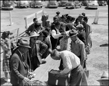 Turlock, California. Baggage is inspected as families arrive at Turlock assembly center. Evacuees . . . - NARA - 537640