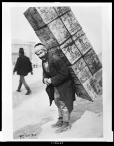 Turkish porter carrying tanks of kerosene on his back LCCN2010650586