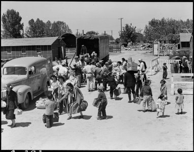 Turlock, California. Families of Japanese ancestry at the Turlock Assembly center. Their baggage w . . . - NARA - 537639