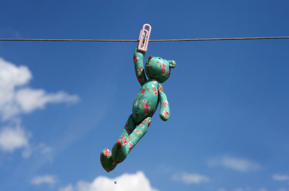 Childhood toy bear sky