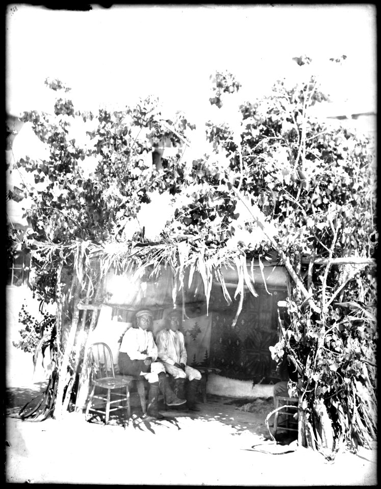 Two Acoma Indian men sitting before the sacred kisi of San Esteban, Acoma Pueblo, 1886 (CHS-4532)