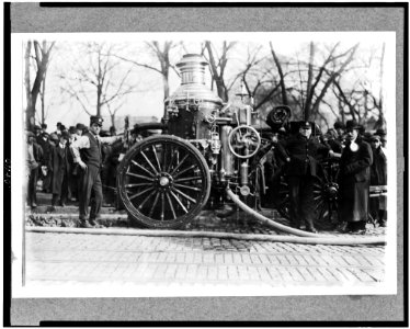 Two firemen with fire engine LCCN93502712