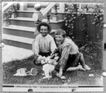 Two boys holding down another boy on lawn, and putting J.B. Williams & Co.'s barbers soap on his face LCCN2002723367