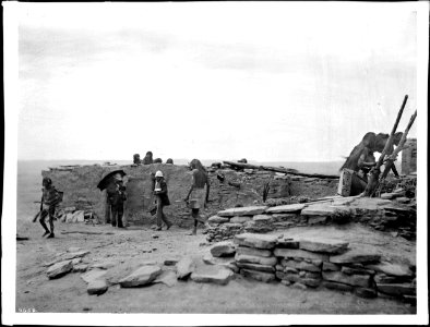 Two Hopi snake priests out at sunrise to hunt for ceremonial snakes on the first day of the Snake Dance Ceremony at the pueblo of Oraibi, Arizona, ca.1898 (CHS-4659)