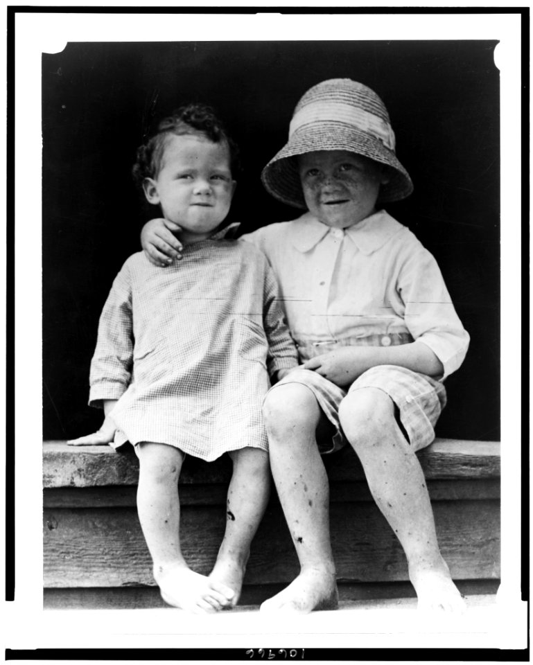Two children, seated on step, facing front LCCN92522666