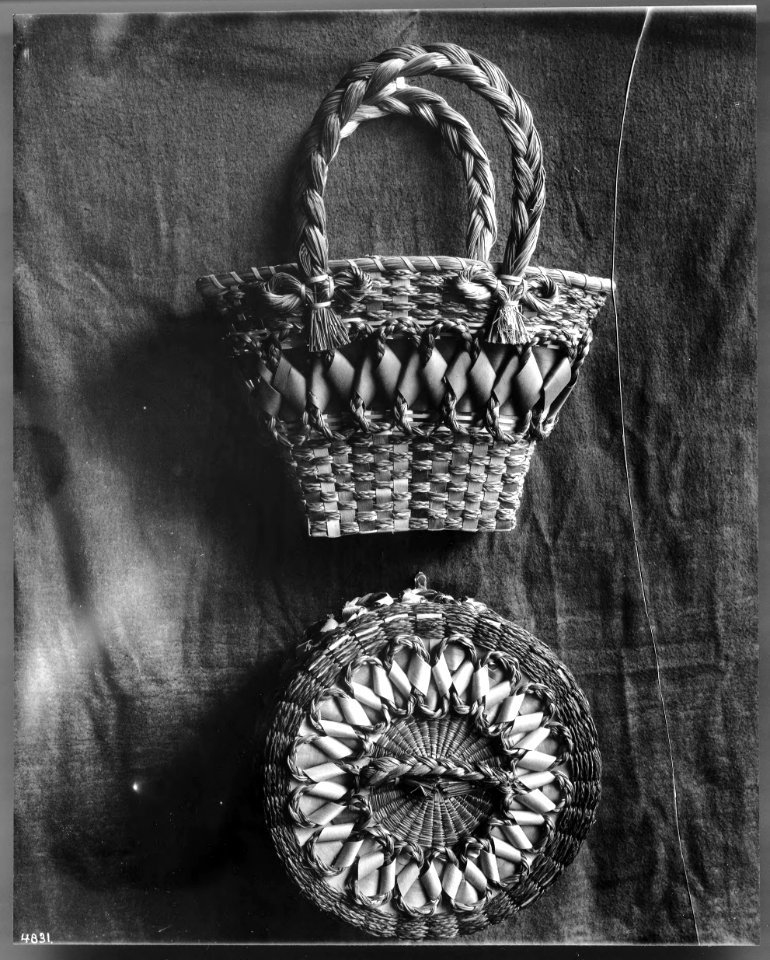 Two Indian baskets displayed against a cloth backdrop, ca.1900 (CHS-4831)