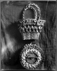 Two Indian baskets displayed against a cloth backdrop, ca.1900 (CHS-4831)