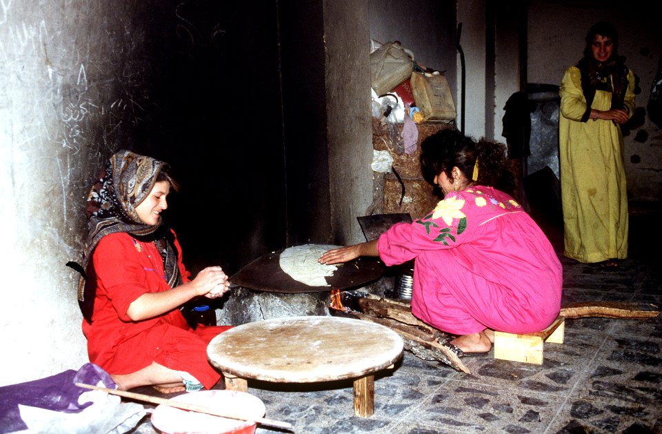 Two Kurdish women preparing their meal at a village in northern Iraq. DF-ST-98-01542