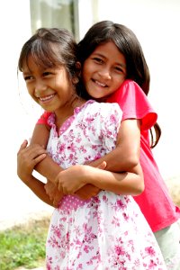 Two joyful Acehnese girls at a USAID-funded house; USAID Indonesia; March 2008