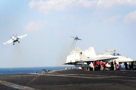 Two F-A-18s launch from USS Dwight D. Eisenhower. (8202184023)