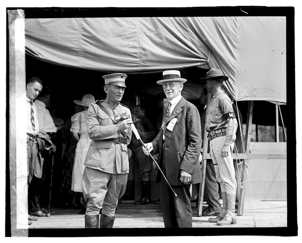 Two men outside tent building LOC npcc.06655