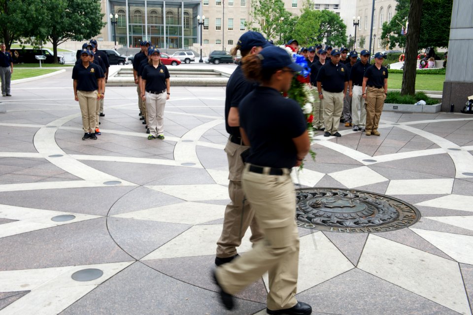 Two law enforcement explorers carrying a wreath at the National Law Enforcement Officers Memorial