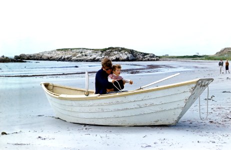 Two JFKs in beached rowboat, 1963 photo