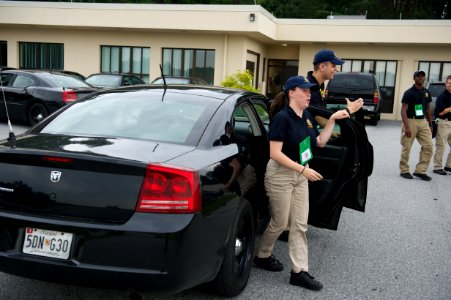 Two law enforcement explorers exited from a car