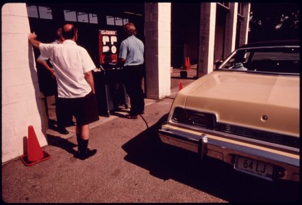 Two Motorists Watch as Carbon Monoxide and Hydrocarbon Emission Readings Are Registered on the Exhaust Analyzer...08-1975 (4266520696)