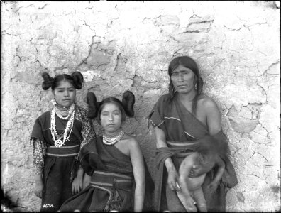 Two Hopi maidens and a matron holding a baby, Arizona, ca.1898 (CHS-4608)