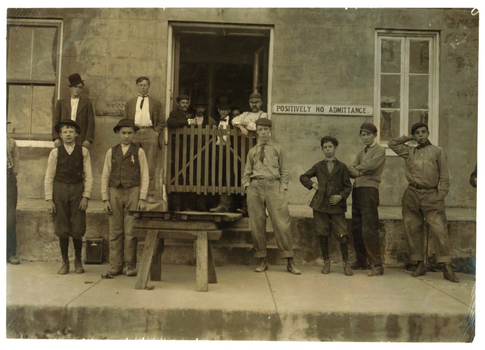Two of the Boys Working in Phoenix American Cob Pipe Factory, Washington, Mo. Smallest boy is Joe Krummel. See sign, 'Wanted-Men and Boys.' Around corner was a sign, 'Girls Wanted.' Couldn't LOC nclc.04691