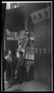 Two men standing on a sidewalk, Chinatown, San Francisco LOC agc.7a55071