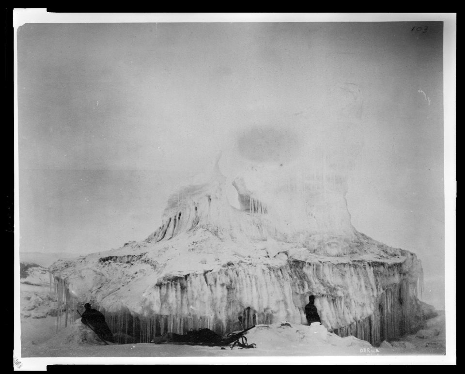 Two men with sled in front of a large ice formation during the Lady Franklin Bay Expedition LCCN2009634174